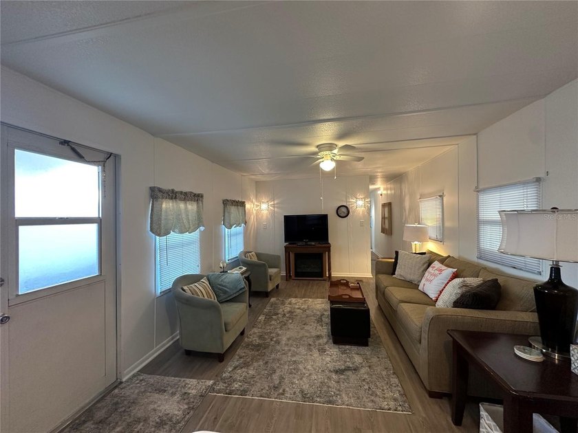 Welcome to Holiday Park! This turn-key furnished LAND-OWNED - photo 6
