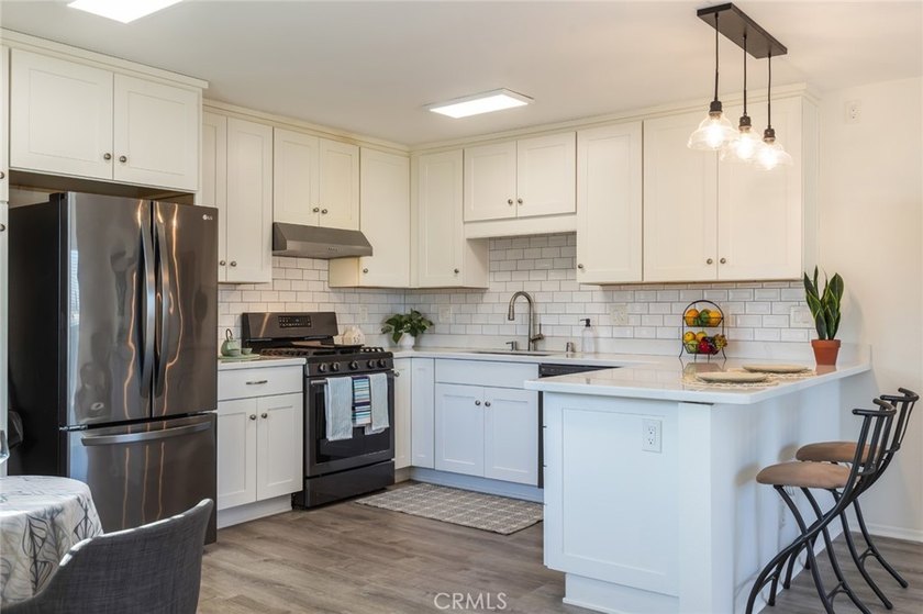 Welcome home to this rare and beautifully remodeled 2-bedroom - photo 6