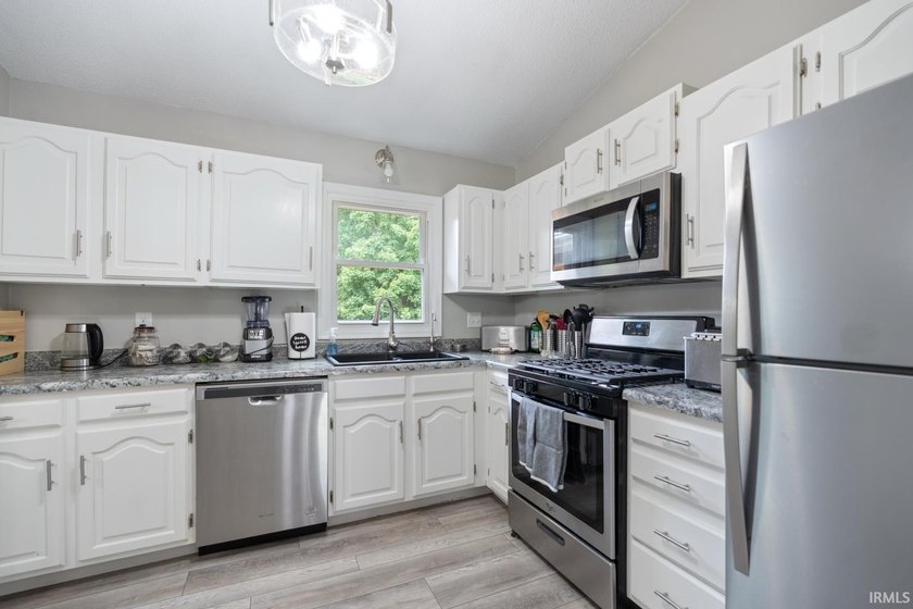 Step inside this beautifully updated split-level home where - photo 9