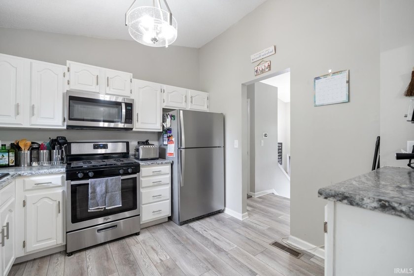 Step inside this beautifully updated split-level home where - photo 10
