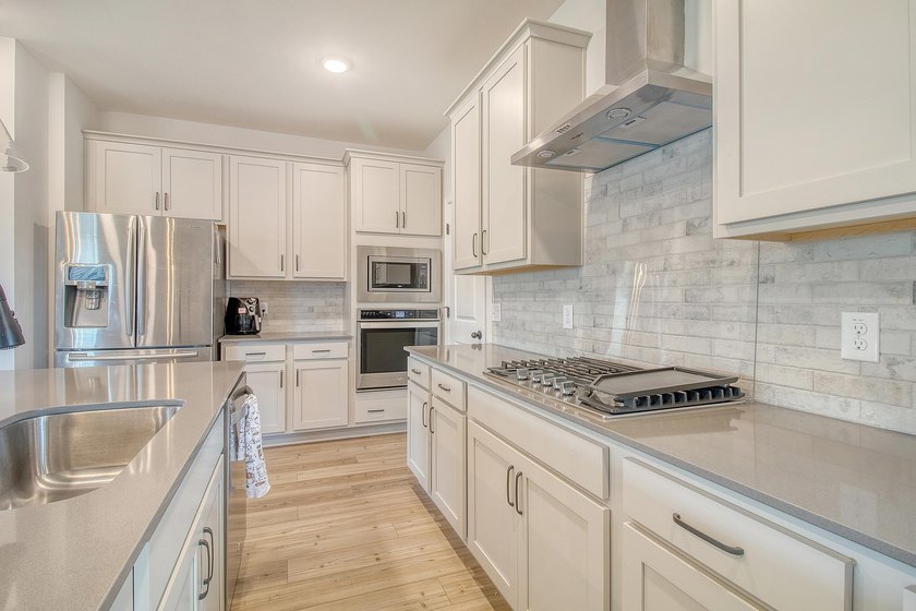 Proudly presenting this exceptional 4-bedroom, 2.5-bathroom home - photo 3