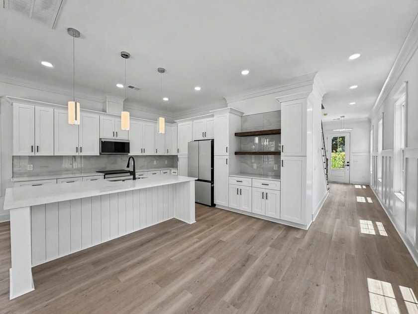 Welcome to 1988 Irving Avenue, a beautifully crafted new - photo 9