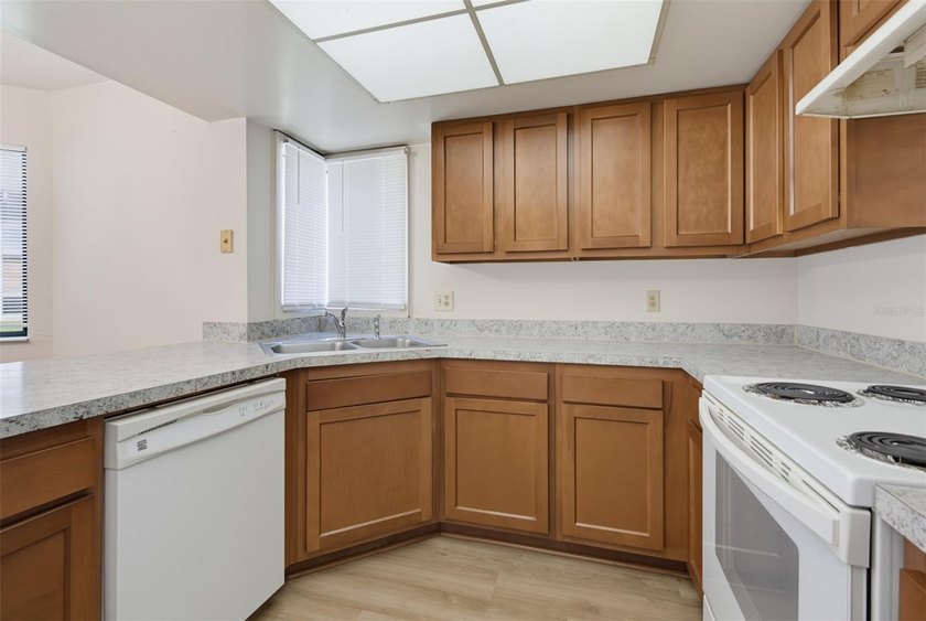 This 2 bedroom, 2 bathroom first floor condo is conveniently - photo 10