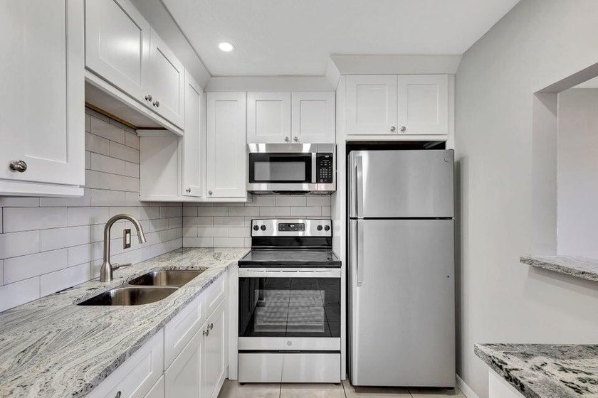 Beautifully remodeled ground floor unit in a gated 55 + - photo 2