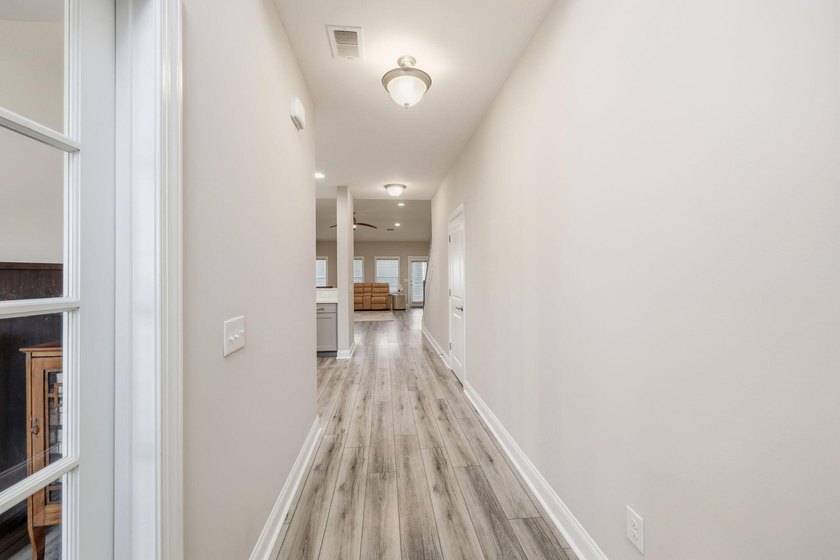 Nestled on a picturesque cul-de-sac, this exceptional, freshly - photo 3