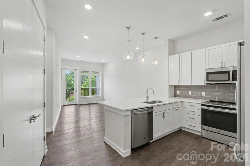 Perched on the top floor of one of NoDa's most coveted addresses - photo 16