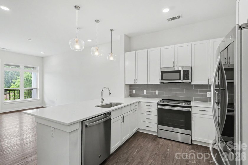 Perched on the top floor of one of NoDa's most coveted addresses - photo 18