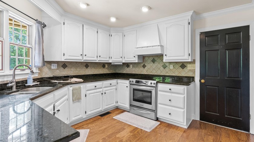 Tucked just minutes from the lake, this spacious home offers - photo 16