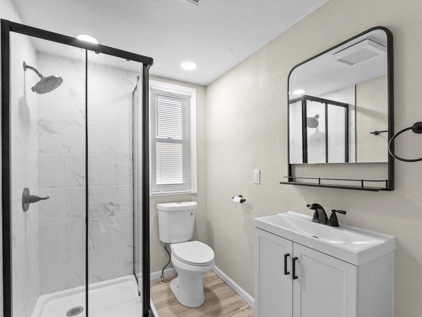 This beautifully renovated 5-bedroom, 2-bath home has been - photo 19