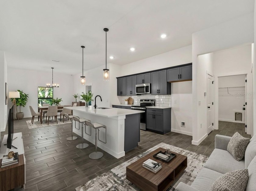 Virtually Staged. Tile throughout. Quartz countertops. Impact - photo 3
