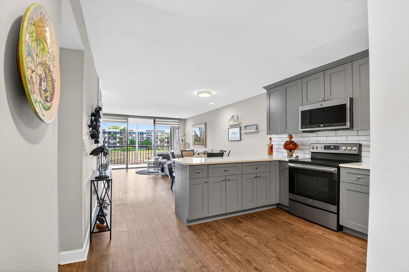 This turnkey 55+ condo is nestled within the sought-after - photo 2