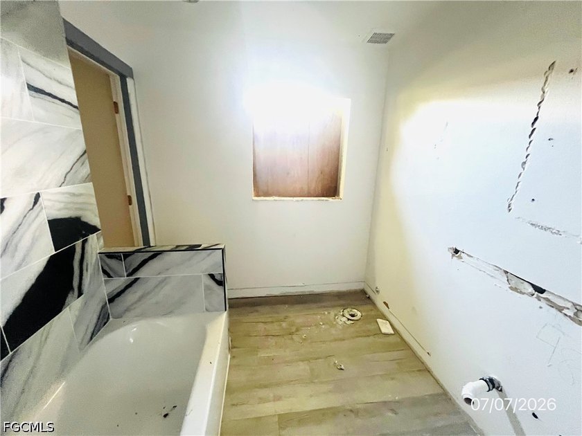 Property requires a full renovation. Damage includes missing - photo 9