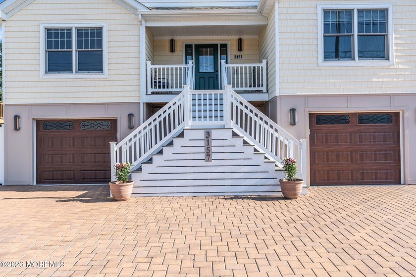 Custom-built in 2023 with water views, this meticulously - photo 3