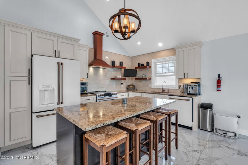 Custom-built in 2023 with water views, this meticulously - photo 8