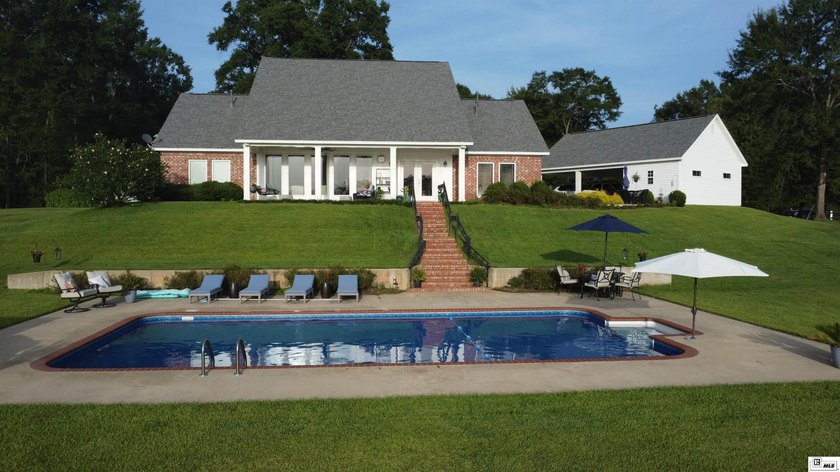 Nestled on a hilltop, this stunning lake home offers expansive - photo 2