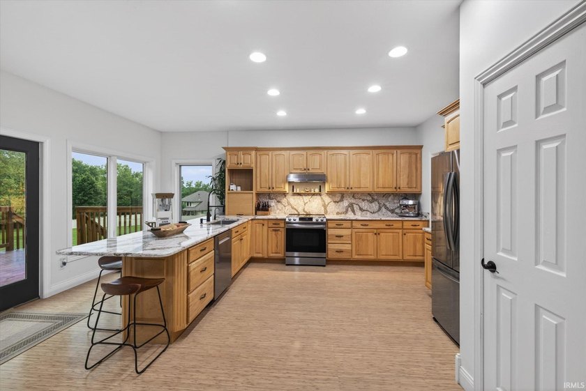 This custom-built one-and-a-half story home over a full walk-out - photo 6