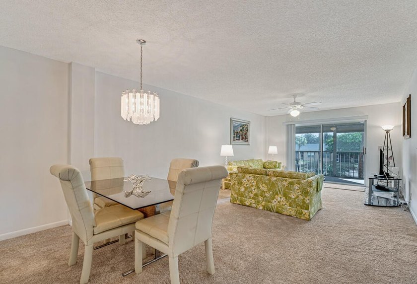 This turnkey 55+ community condo is move-in ready, featuring a - photo 4