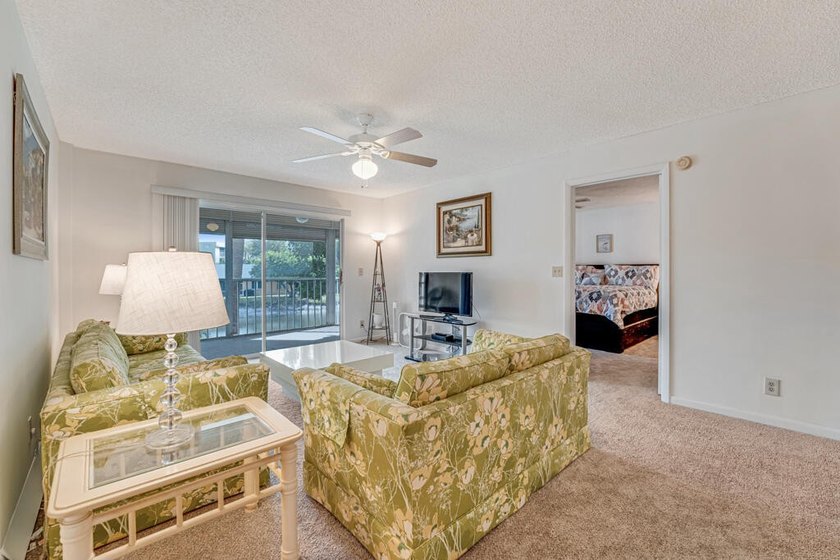 This turnkey 55+ community condo is move-in ready, featuring a - photo 6