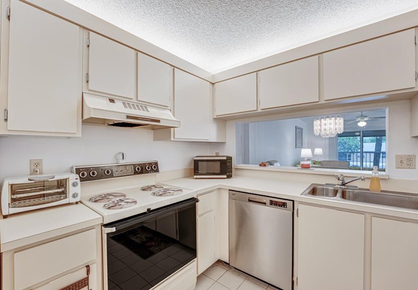This turnkey 55+ community condo is move-in ready, featuring a - photo 9