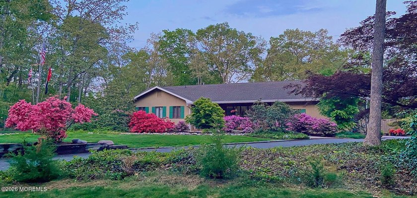 Welcome to this sprawling ranch tucked away on a tree-lined - photo 2