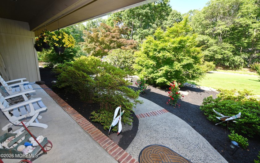 Welcome to this sprawling ranch tucked away on a tree-lined - photo 5