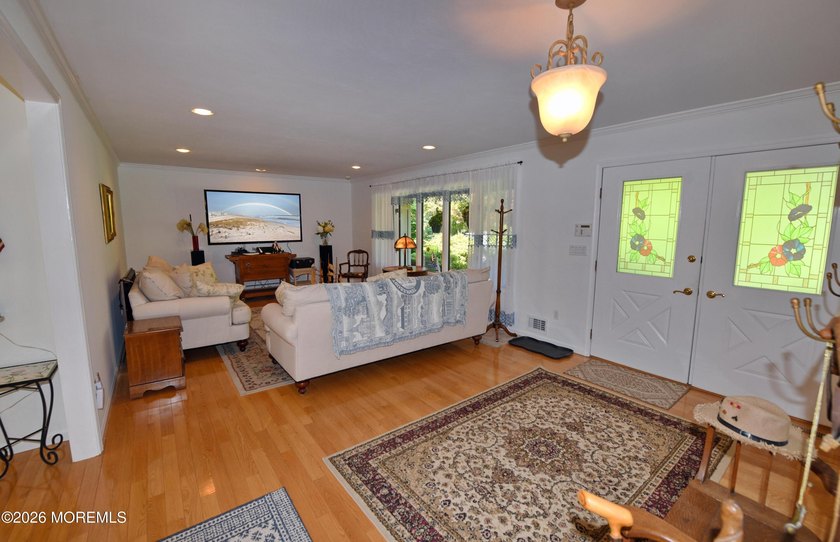 Welcome to this sprawling ranch tucked away on a tree-lined - photo 7