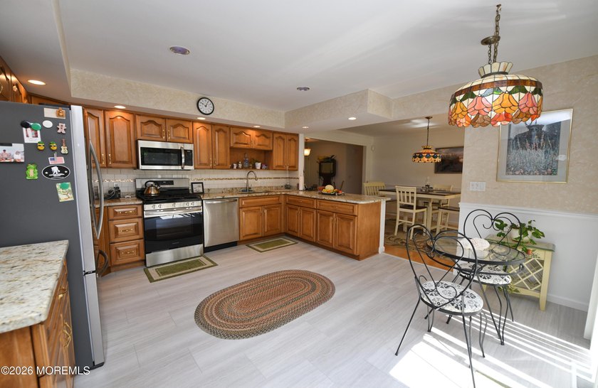 Welcome to this sprawling ranch tucked away on a tree-lined - photo 10