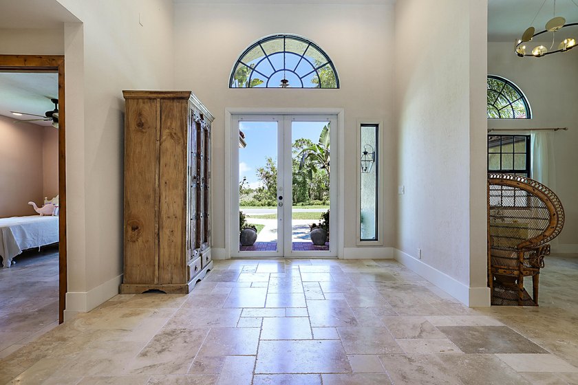 Numerous luxury upgrades! Newer roof, complete impact - photo 6
