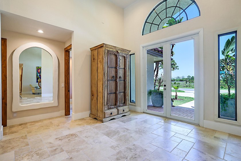 Numerous luxury upgrades! Newer roof, complete impact - photo 9