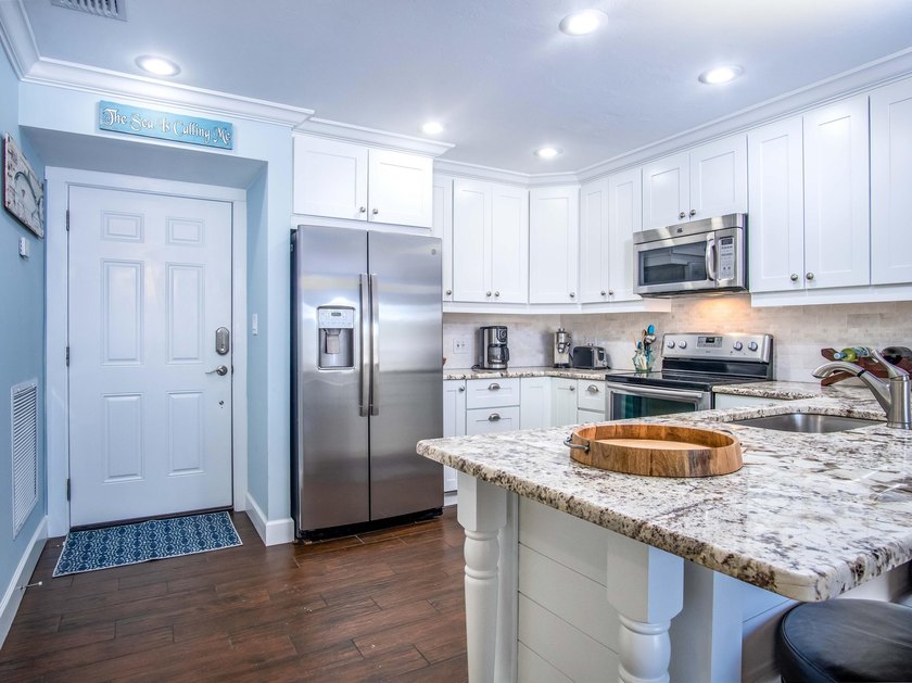Beautiful end ground floor and corner unit. Enjoy the waterfront - photo 7