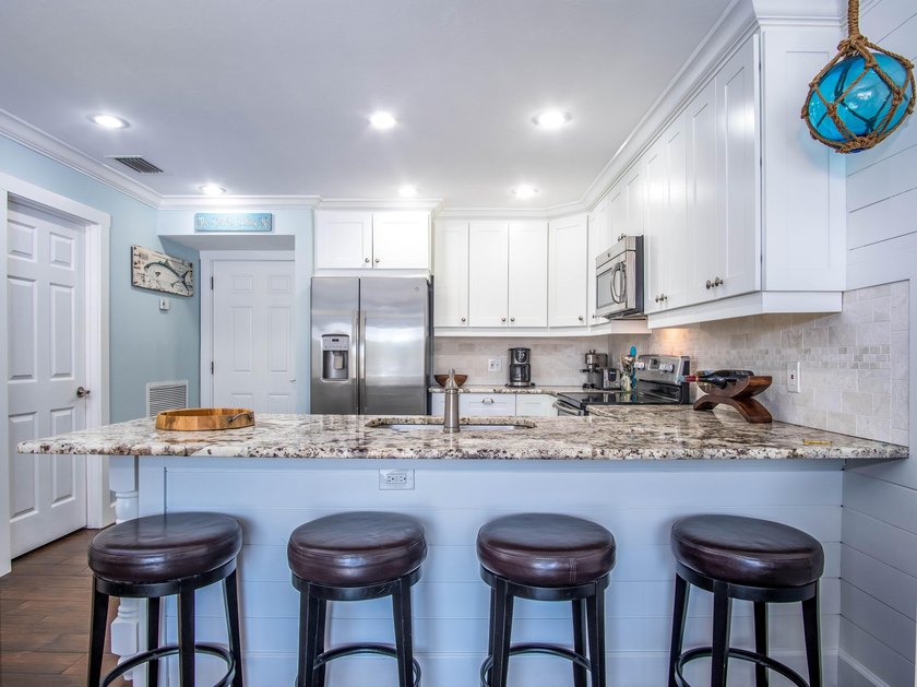 Beautiful end ground floor and corner unit. Enjoy the waterfront - photo 9