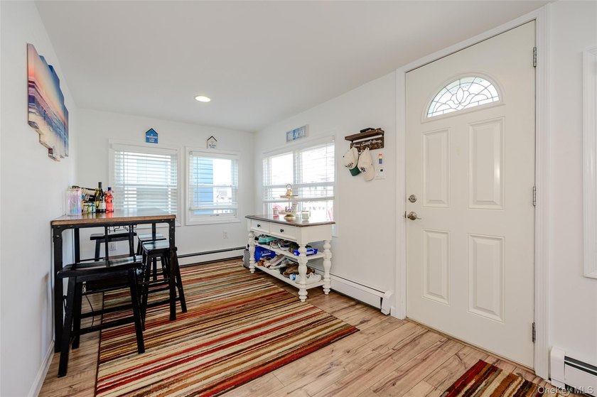 Welcome to this beautifully renovated raised ranch in Long - photo 4