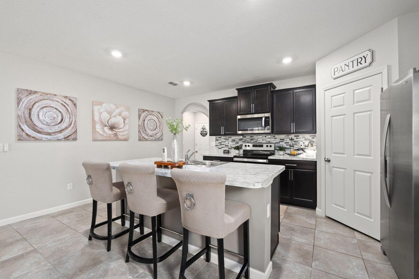 Welcome to this stunning spacious Cali model home located in the - photo 7