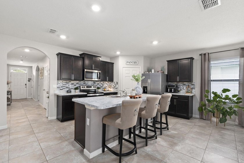 Welcome to this stunning spacious Cali model home located in the - photo 8