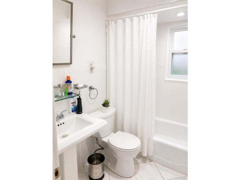 This well-maintained two-family home offers 4 spacious bedrooms - photo 5