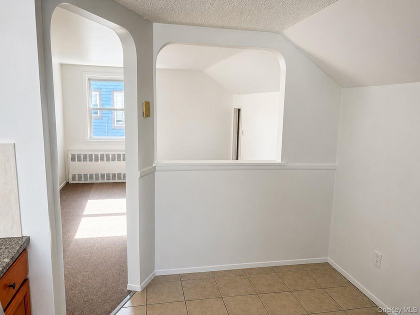 This well-maintained two-family home offers 4 spacious bedrooms - photo 10
