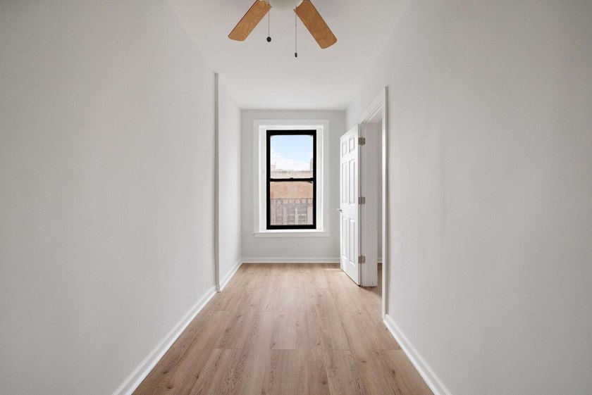 213 East 120th Street presents a compelling four-unit, mixed-use - photo 14