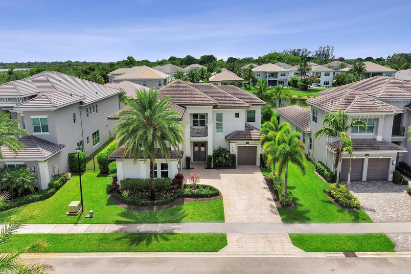 Discover elevated Florida living in this exceptional 5-bedroom - photo 11