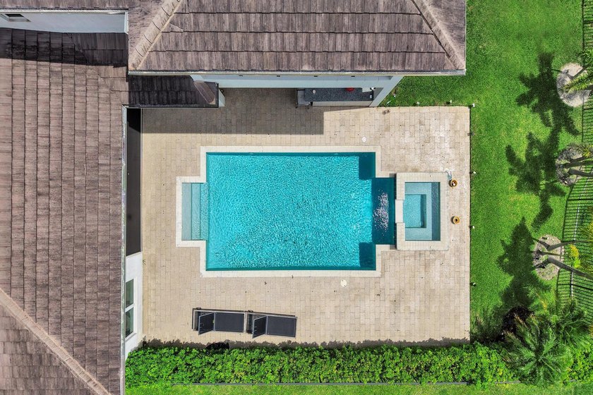 Discover elevated Florida living in this exceptional 5-bedroom - photo 12