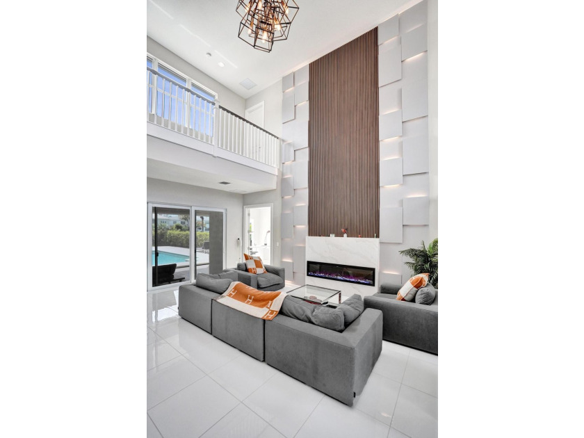 Discover elevated Florida living in this exceptional 5-bedroom - photo 14