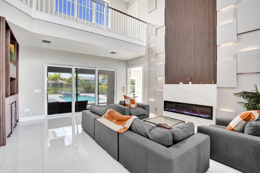 Discover elevated Florida living in this exceptional 5-bedroom - photo 16