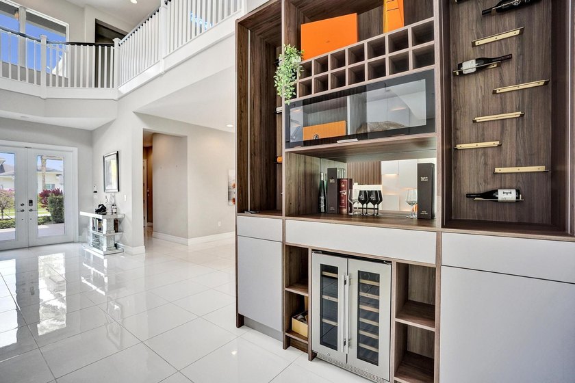 Discover elevated Florida living in this exceptional 5-bedroom - photo 18