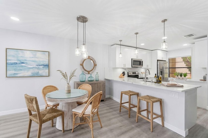 FULLY RENOVATED, 1st-FLOOR, LAKE FRONT condo located in the - photo 3