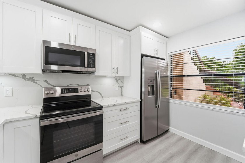 FULLY RENOVATED, 1st-FLOOR, LAKE FRONT condo located in the - photo 4