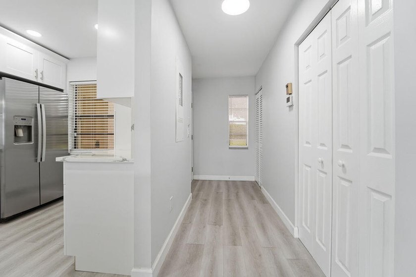 FULLY RENOVATED, 1st-FLOOR, LAKE FRONT condo located in the - photo 7