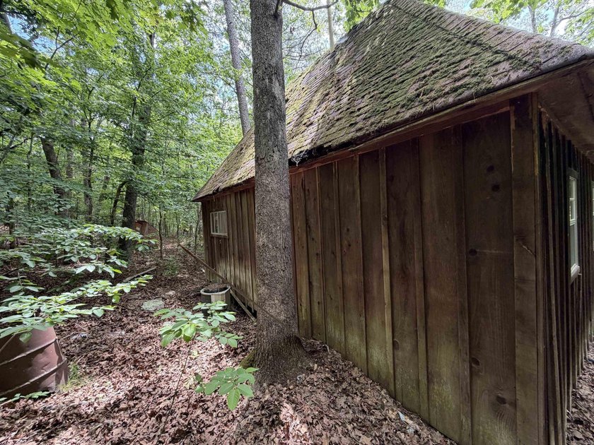 Escape to a truly remote lakeside hideaway spanning 5 acres and - photo 9