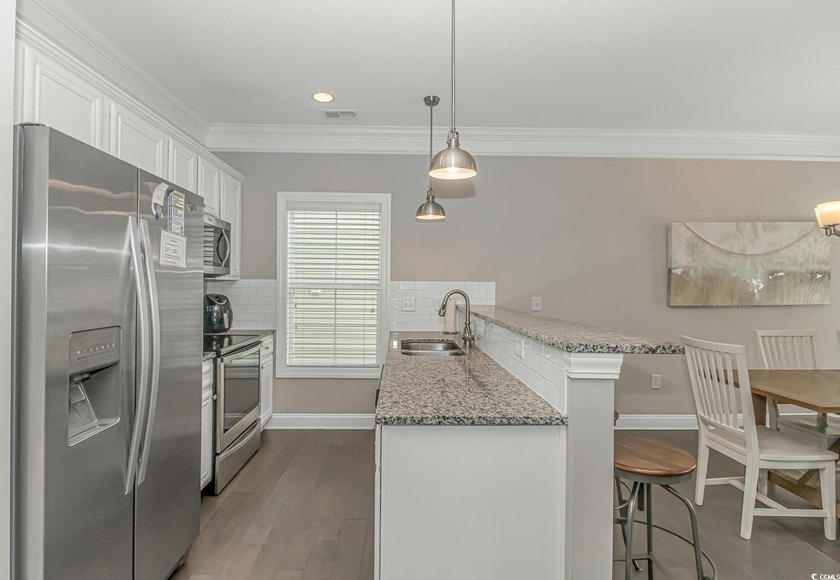 This very open and spacious 5-Bedroom, 5-Bath raised beach house - photo 9