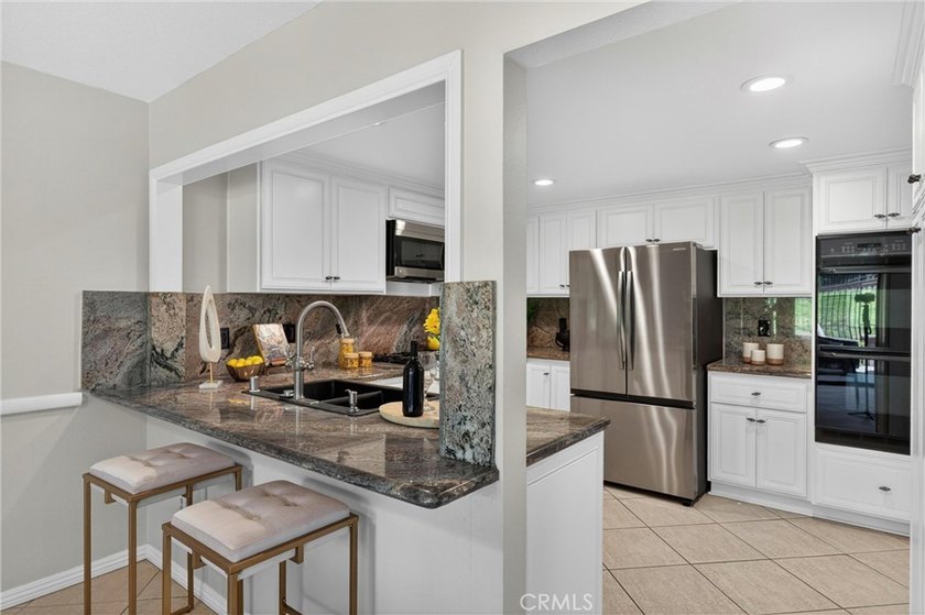Welcome to this beautifully maintained residence in the highly - photo 19