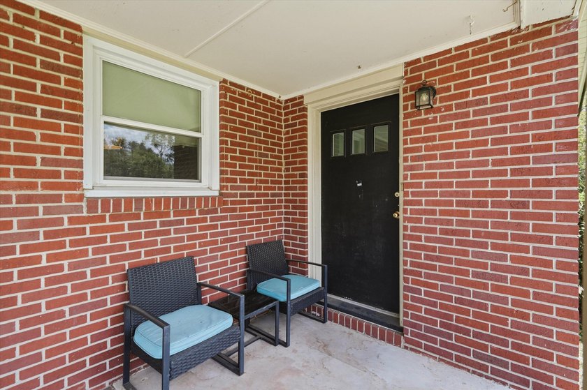 Welcome home to this charming brick residence nestled on a quiet - photo 3