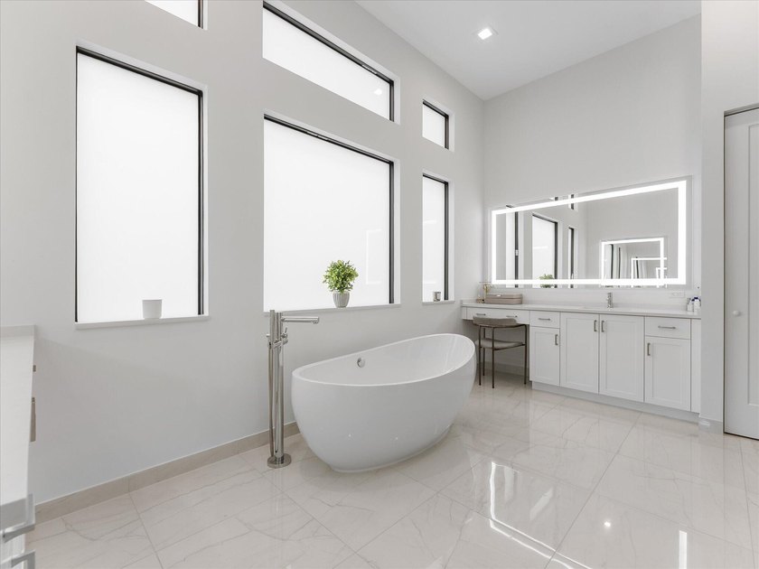 Welcome to this stunning 2025 built home in Lotus Edge, set on - photo 16